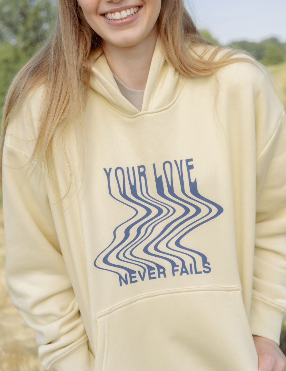 Love-Never-Fails-Cream-Unisex-Hoodie_01_8dd501e1-6301-4fe6-8cde-4fe7ef372e51.jpg