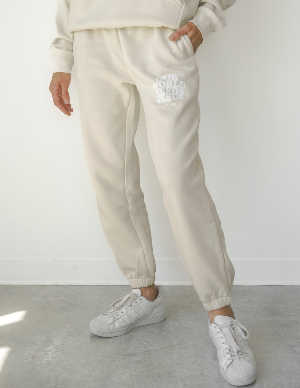 Our-World-Needs-Jesus-Beige-Unisex-Sweatpant_01_6adc6673-2148-4c5f-ab2a-12a458895f7d.jpg
